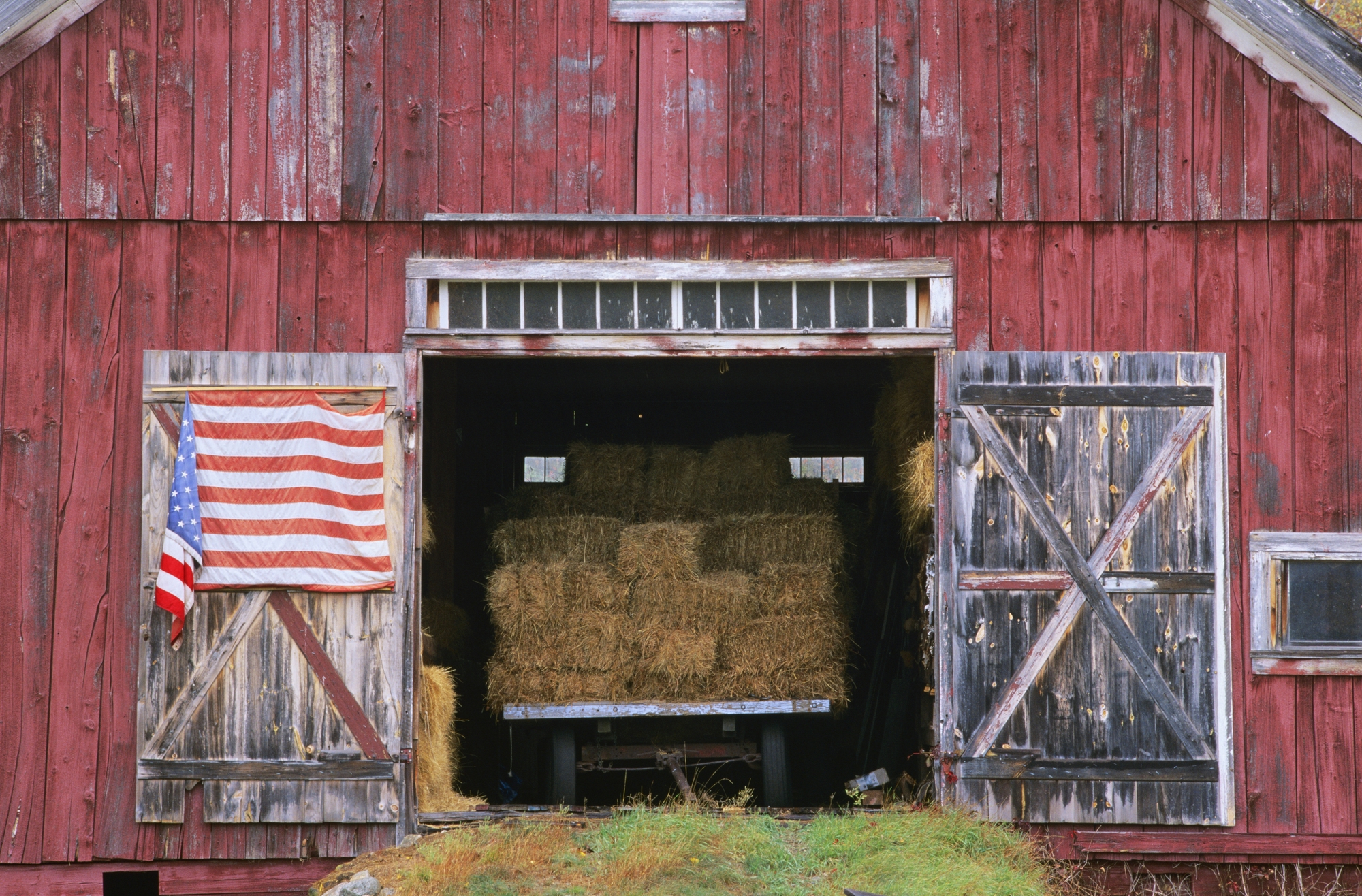 American Flag Hanging From A Barn Door